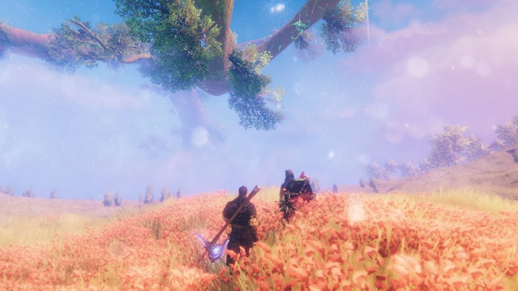 A screenshot of Valheim gameplay, with two Viking warriors going through a field looking at Yggdrasil in the distance